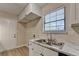 Bright kitchen featuring white cabinets, marble countertops, and stainless steel appliances at 4384 Raven Valley Ct, Decatur, GA 30035