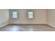 Bright living room featuring hardwood floors and two windows offering natural light at 4384 Raven Valley Ct, Decatur, GA 30035