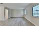 Bright living room with large window, providing natural light and modern flooring at 4384 Raven Valley Ct, Decatur, GA 30035