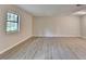 Bright and airy living room featuring light-colored walls and sleek, updated flooring at 4384 Raven Valley Ct, Decatur, GA 30035