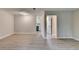 Open living area with modern flooring and neutral tones, leading to the kitchen at 4384 Raven Valley Ct, Decatur, GA 30035