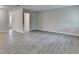 Spacious room featuring modern flooring and open doorway leading to other spaces at 4384 Raven Valley Ct, Decatur, GA 30035