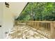 A spacious wooden deck with railings is attached to the side of the house at 5729 Jefferson Ave, Forest Park, GA 30297