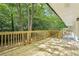 Spacious wooden deck surrounded by mature trees attached to house at 5729 Jefferson Ave, Forest Park, GA 30297