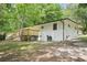 Backyard view featuring a spacious lawn, concrete pad, and back deck on the house at 5729 Jefferson Ave, Forest Park, GA 30297