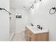 Elegant bathroom with double sink vanity, modern lighting, and matte black fixtures offers style and convenience at 5729 Jefferson Ave, Forest Park, GA 30297