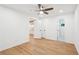 Bedroom features neutral walls, light wood floors, recessed lights, and ceiling fan with access to ensuite at 5729 Jefferson Ave, Forest Park, GA 30297