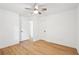 The bedroom has a ceiling fan and wood-look floors, and a connecting door at 5729 Jefferson Ave, Forest Park, GA 30297