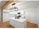 Bright kitchen featuring white cabinets, stainless appliances, island with seating, and pendant lighting at 5729 Jefferson Ave, Forest Park, GA 30297