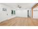 Bright living room featuring light wood flooring, white walls, ceiling fan, and recessed lights at 5729 Jefferson Ave, Forest Park, GA 30297
