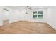 Bright living room featuring light wood flooring, white walls, ceiling fan, and recessed lights at 5729 Jefferson Ave, Forest Park, GA 30297