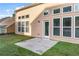 A concrete patio overlooks the lawn in the backyard at 971 Reap Lane, Lawrenceville, GA 30043