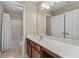 Bathroom with sink, shower with curtain, and large mirror at 971 Reap Lane, Lawrenceville, GA 30043