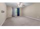 Neutral bedroom featuring a ceiling fan and large window at 971 Reap Lane, Lawrenceville, GA 30043