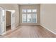 Bright bedroom with large windows and an open closet at 971 Reap Lane, Lawrenceville, GA 30043