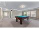 Upstairs bonus room with a pool table, carpet floors, and natural light at 971 Reap Lane, Lawrenceville, GA 30043