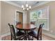 Cozy breakfast nook with a round table, wood floors, and a large window for natural light at 971 Reap Lane, Lawrenceville, GA 30043