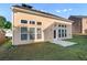 A view of the back of the home and backyard from the side lawn at 971 Reap Lane, Lawrenceville, GA 30043