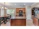 Eat-in kitchen with granite countertops, stainless appliances, and pendant lighting at 971 Reap Lane, Lawrenceville, GA 30043