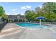 Enjoy the community pool with a mushroom water feature, surrounded by lush trees, for relaxing summer days at 971 Reap Lane, Lawrenceville, GA 30043