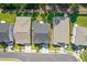 Aerial view of rooftops with pristine landscaping and community street at 704 Chipping Sparrow St, Canton, GA 30115