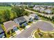 Overhead view of homes with pristine landscaping and a well-planned community layout at 704 Chipping Sparrow St, Canton, GA 30115