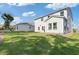 A view of the home's backyard with a lush lawn and patio at 704 Chipping Sparrow St, Canton, GA 30115