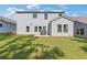 Spacious backyard with a well-maintained lawn and patio area at 704 Chipping Sparrow St, Canton, GA 30115