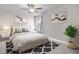 Inviting bedroom features a comfortable bed, stylish decor, and a decorative rug at 704 Chipping Sparrow St, Canton, GA 30115