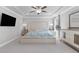 Bright bedroom featuring a tray ceiling, plenty of natural light, and neutral decor at 704 Chipping Sparrow St, Canton, GA 30115