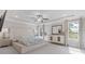 Serene bedroom with a large bed, a ceiling fan and plenty of natural light at 704 Chipping Sparrow St, Canton, GA 30115