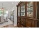 Traditional dining room featuring a china cabinet and dining set with seating for six at 704 Chipping Sparrow St, Canton, GA 30115