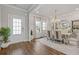 Elegant dining room featuring a modern chandelier, stylish chairs, and ample natural light at 704 Chipping Sparrow St, Canton, GA 30115