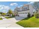 Inviting home with a well-kept lawn, double-car garage and neutral siding, situated on a sunny street at 704 Chipping Sparrow St, Canton, GA 30115