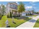Lovely home with stone accents, a two-car garage, and a well-maintained lawn and landscaping at 704 Chipping Sparrow St, Canton, GA 30115