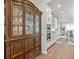 Bright and airy kitchen and dining area featuring modern cabinetry and hardwood flooring at 704 Chipping Sparrow St, Canton, GA 30115