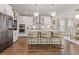 Modern kitchen with stainless steel appliances, a center island, and stylish pendant lighting at 704 Chipping Sparrow St, Canton, GA 30115