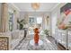 Cozy living room with ample sunlight, comfortable seating, stylish decor and hardwood floors at 704 Chipping Sparrow St, Canton, GA 30115