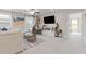 Comfortable living area featuring a large sectional sofa, modern decor, and plenty of natural light at 704 Chipping Sparrow St, Canton, GA 30115