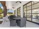 A covered outdoor patio with tables and chairs at 704 Chipping Sparrow St, Canton, GA 30115