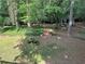 Secluded backyard featuring a gazebo, fountain, and lush landscaping, offering a peaceful outdoor retreat at 125 Fortuna Ct, Roswell, GA 30075