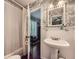 Stylish bathroom featuring a shower, sink and door to another room at 125 Fortuna Ct, Roswell, GA 30075