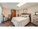 Comfortable bedroom with wood furniture, carpeted floors and a king sized bed at 125 Fortuna Ct, Roswell, GA 30075