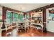 Cozy dining room featuring a wooden table, chairs, and a charming hutch at 125 Fortuna Ct, Roswell, GA 30075