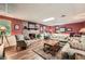 Cozy living room with a brick fireplace and hardwood flooring at 125 Fortuna Ct, Roswell, GA 30075