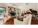 Cozy living room showcasing a stone fireplace, hardwood floors, and comfortable seating arrangement at 125 Fortuna Ct, Roswell, GA 30075