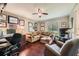 Office/den area featuring a comfortable couch, desk and lots of wall decor at 125 Fortuna Ct, Roswell, GA 30075