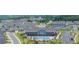 Aerial view of community amenities including clubhouse, swimming pool, tennis courts, and ample parking at 213 Hickory Bluffs Pkwy, Canton, GA 30114