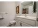 Clean bathroom features a single sink vanity with modern fixtures, tile flooring and lots of light at 213 Hickory Bluffs Pkwy, Canton, GA 30114