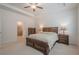 Bedroom with neutral carpet, tray ceilings and lots of natural light with an ensuite bathroom at 213 Hickory Bluffs Pkwy, Canton, GA 30114